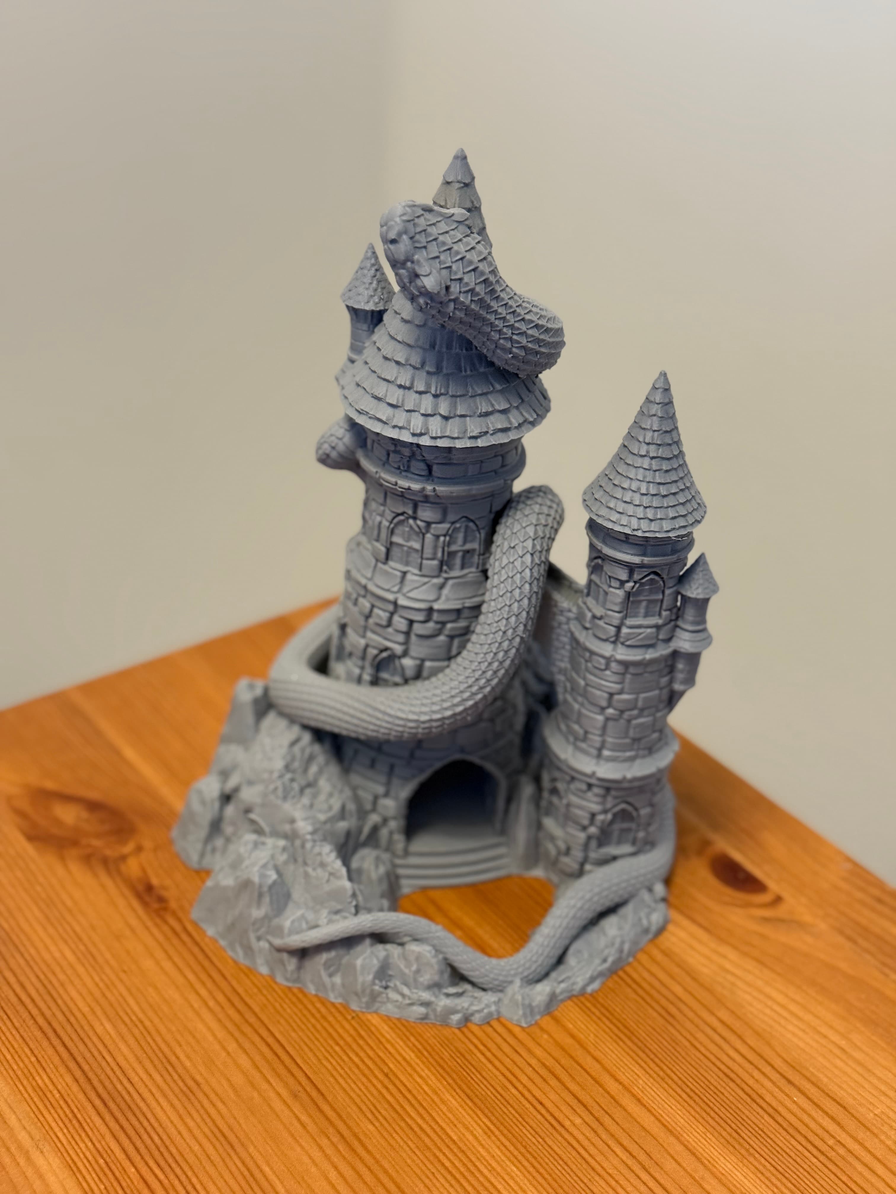 Snake Dice Tower — serpent coiling around twin castle towers